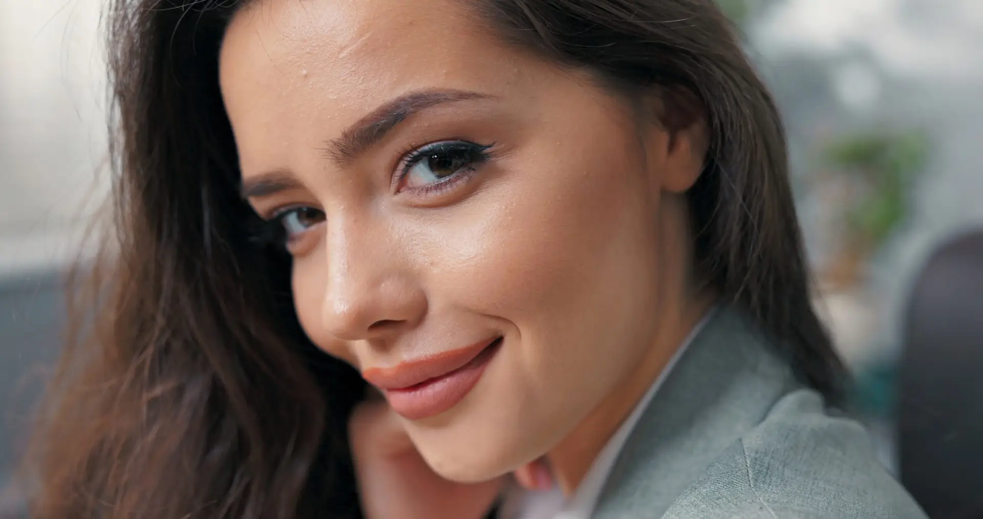 A beautiful woman with restored confidence after her treatment at The Maxim Clinic.