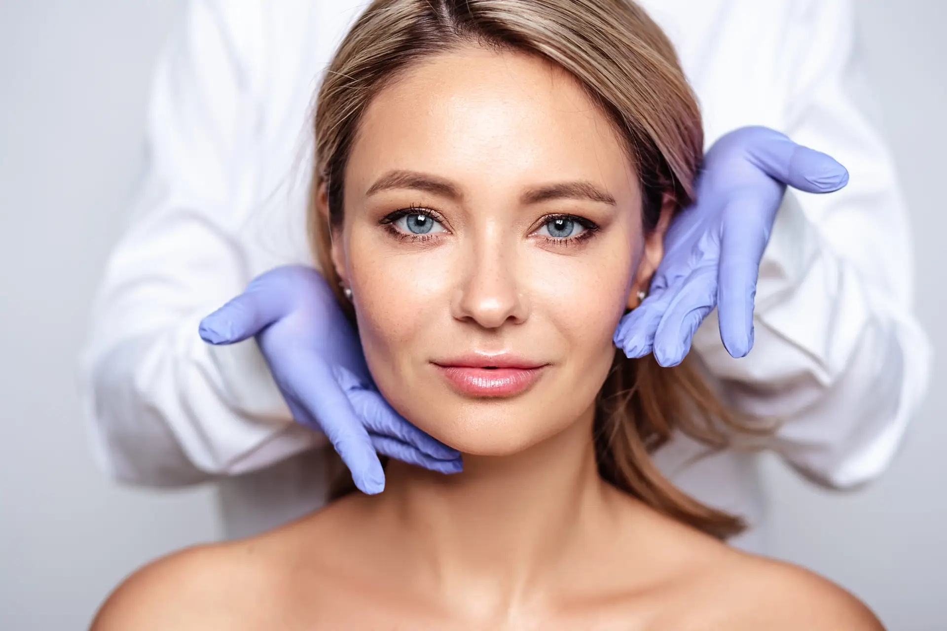 A woman with natural, radiant skin after receiving aesthetic treatment at The Maxim Clinic.