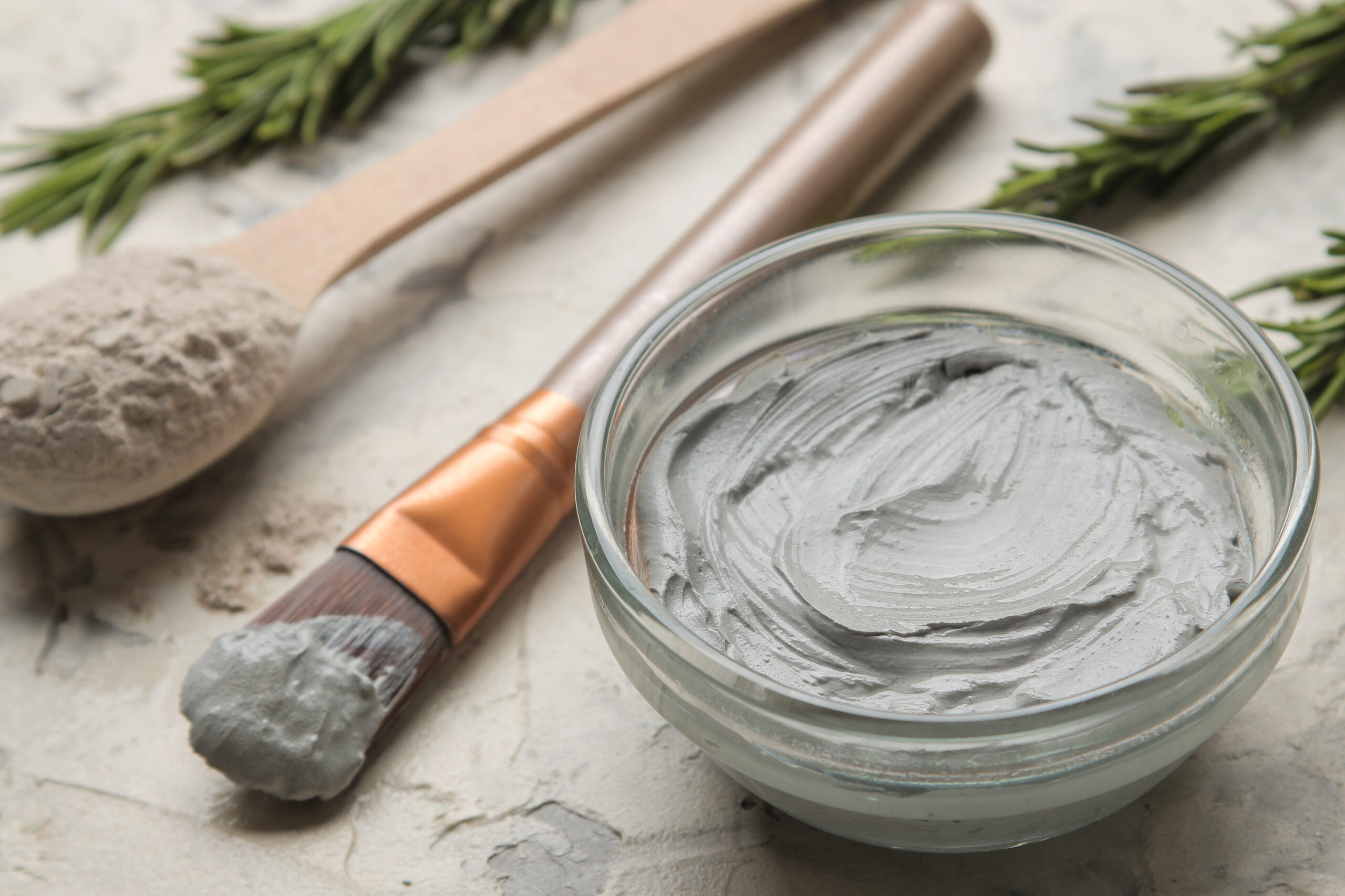 High-quality clinical skincare products including a creamy mask in a ceramic bowl